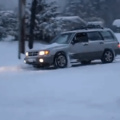 Driver tries to stop a sliding car with a foot, fail